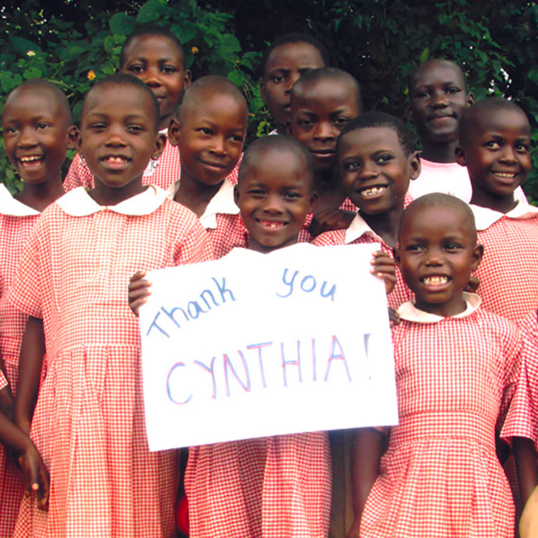 kids with thank you sign